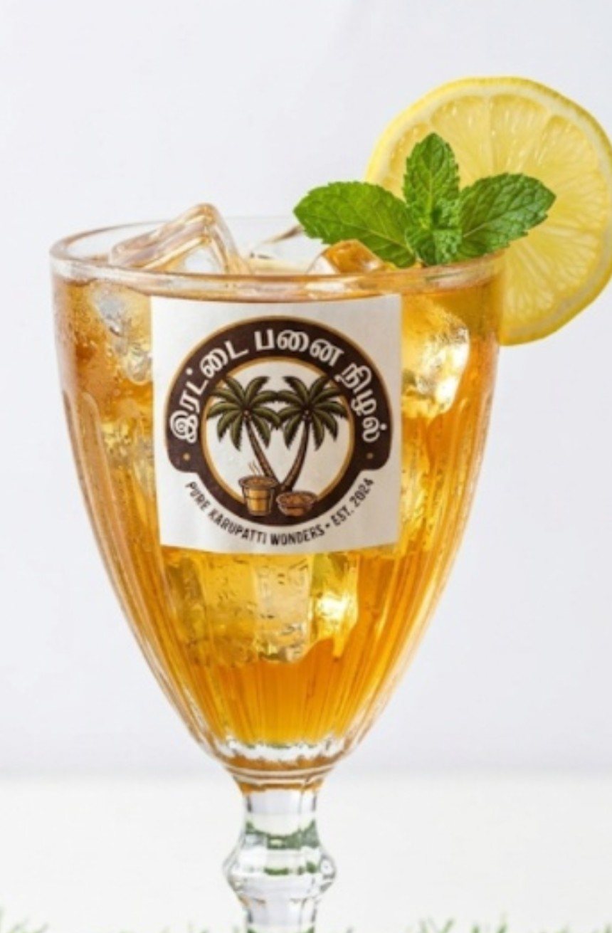 Iced lemon drink in elegant goblet — Irattai Panai Nizhal