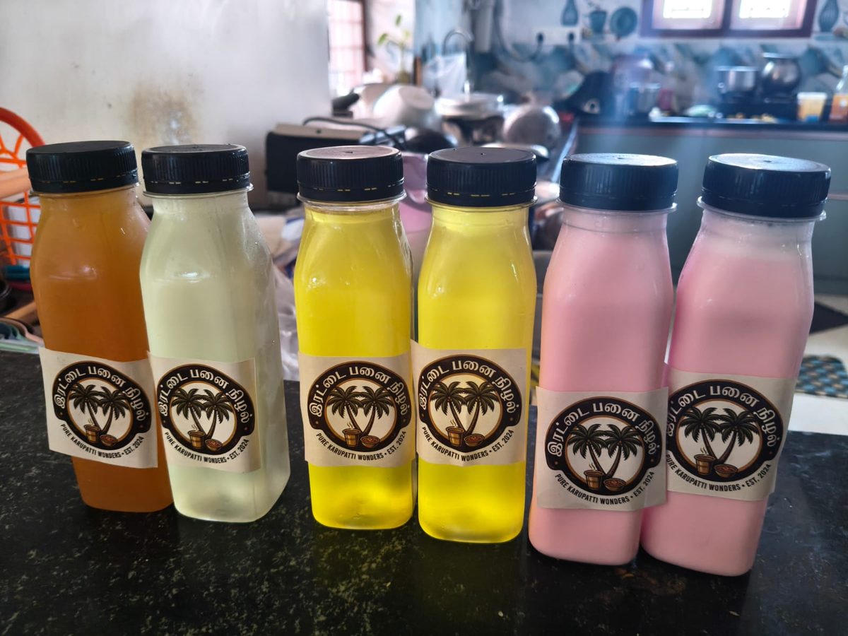 Six Irattai Panai Nizhal branded bottles — orange juice, Nannari, pineapple juice, and rose milk