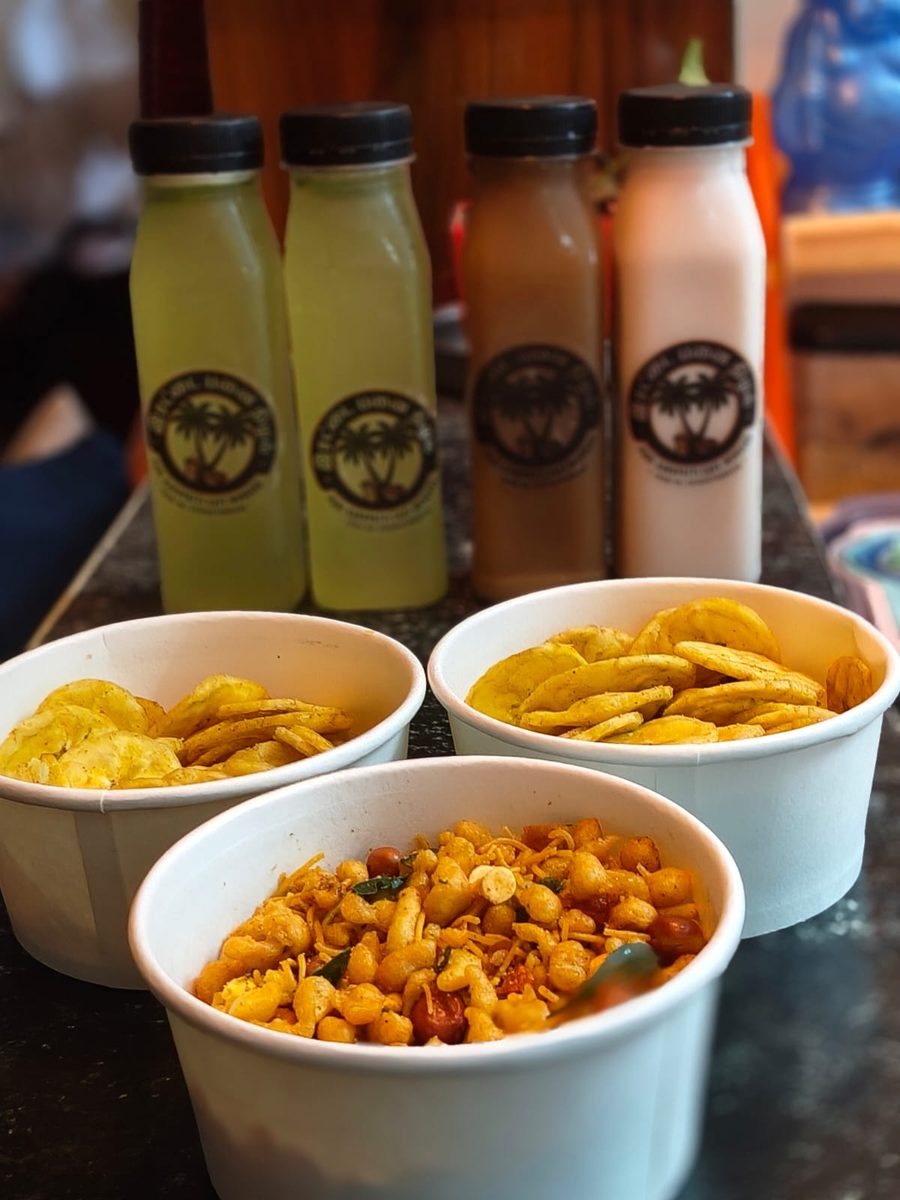 Irattai Panai Nizhal full order — lime juice, nannari sarbath, rose milk bottles with banana chips and mixture snack bowls