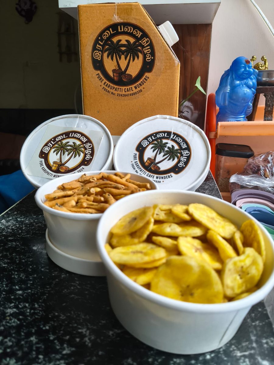 Irattai Panai Nizhal branded delivery box with banana chips and murukku in branded white cups